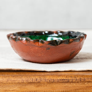Green glazed clay bowl