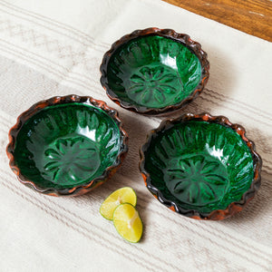 Green glazed clay bowl