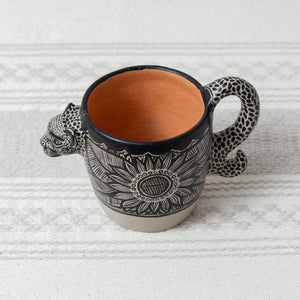 Beige jaguar clay mug with black