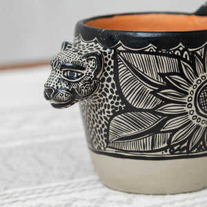 Beige jaguar clay mug with black