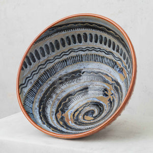 Painted clay spiral fruit bowl, in brown, black and gray tones
