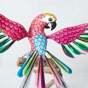 Pink and multicolor alebrije parrot