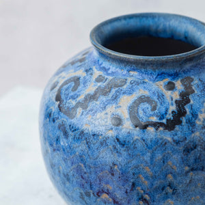 Clay ball vase painted in blue with fretwork