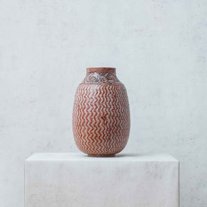 Zigzag clay vase painted in terracotta tones