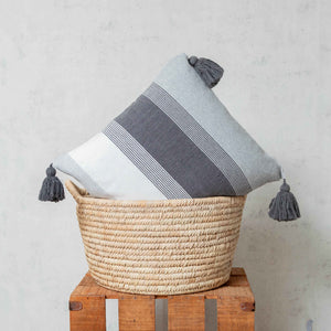 Pedal loom tassels cushion in gray and white tones