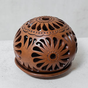 Burnished clay ball candle holder, large brown openwork