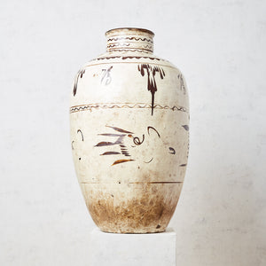 Beige ceramic vessel