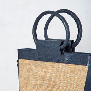 Navy blue jute and leather trapeze bag